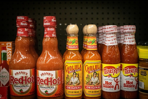 Hot Sauce Maker Sues Manufacturer Over Exploding Bottles and Insurance Dispute